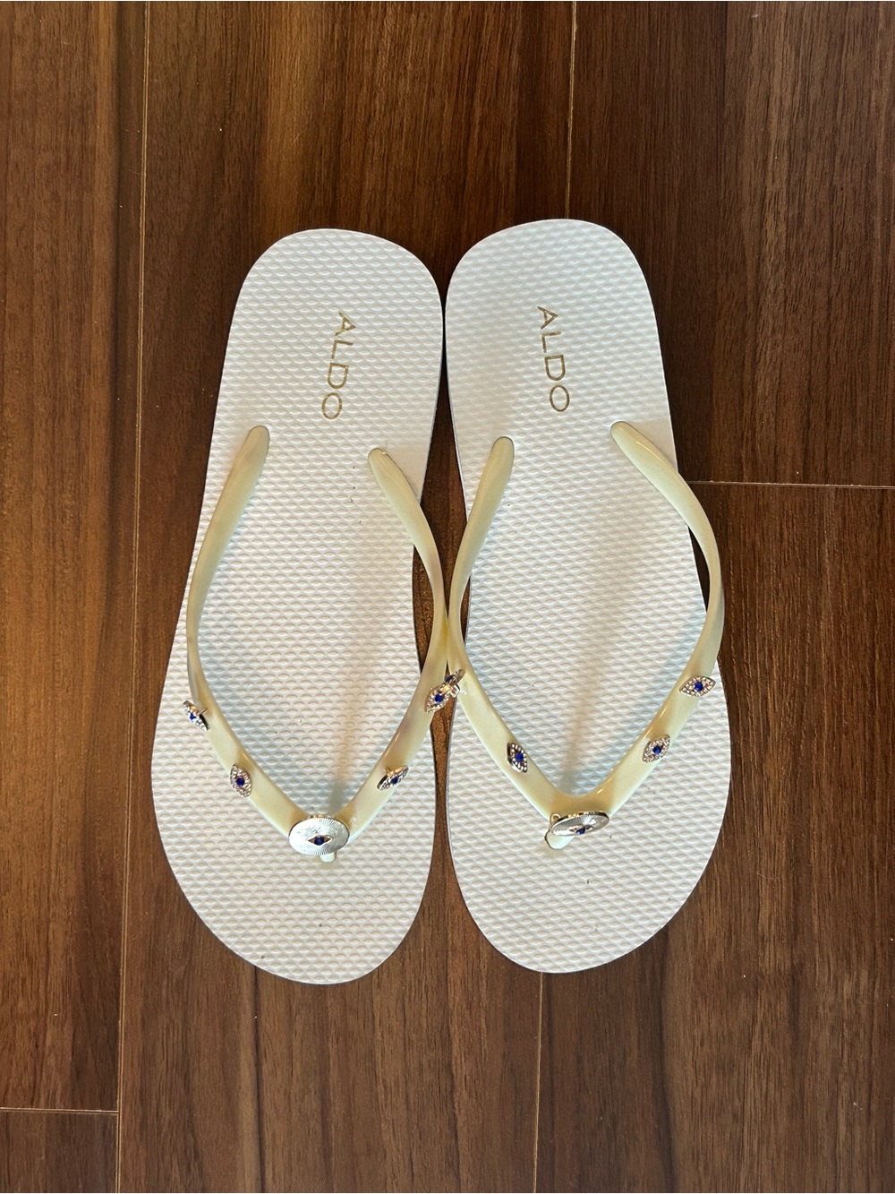 ALDO white Flip Flop Sandals with Gold-Tone Jewel Accents